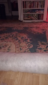 aubusson rug half unrolled because it is too big